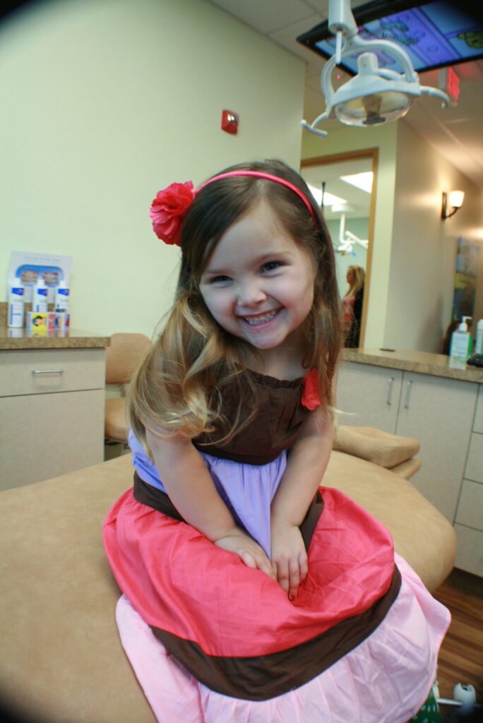 Pediatric space maintainer being fitted for a child at our Celebration FL practice