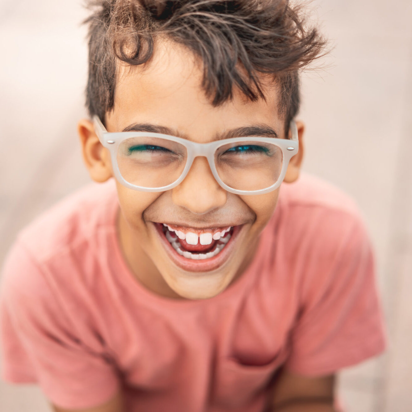 Happy boy laughing outdoors First Dentist Visit